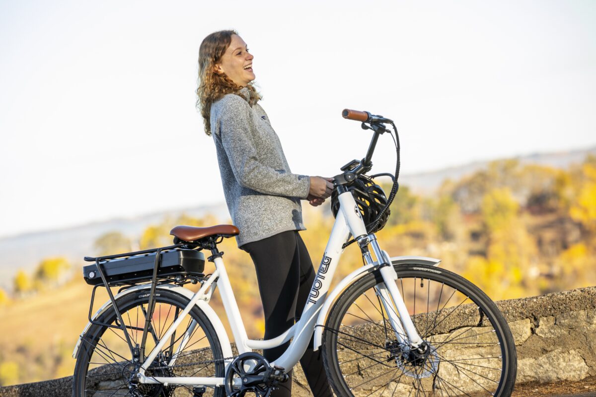 woman about to ride white ebike