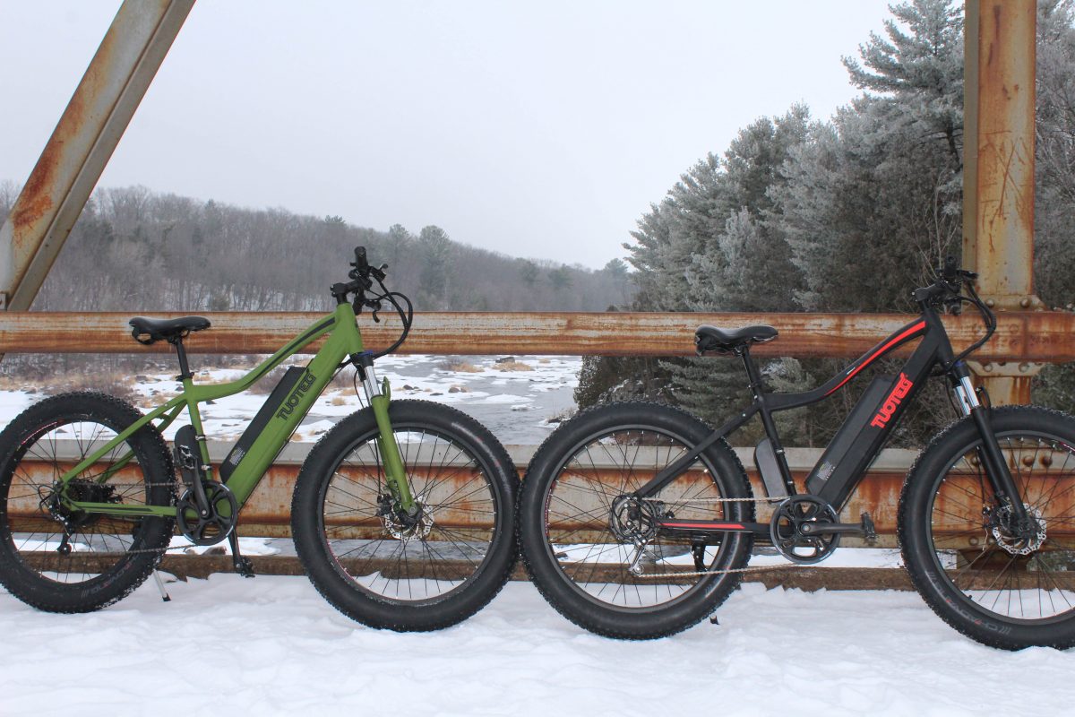 electric bikes on bridge in snow